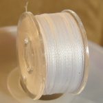 Waxed stringing thread, white