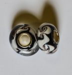 Pandora bead, on white base black swirls